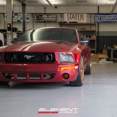 Staggered Variant Xenon in Brushed Bronze on a 2005 Ford Mustang GT