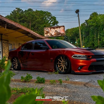 Staggered 22 inch Ferrada FR4 in Matte Bronze w/ Gloss Black Lip on a 2021 Dodge Charger