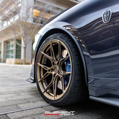 Staggered 20 inch Variant Nysa in Gloss Bronze on a 2024 Ford Mustang Dark Horse