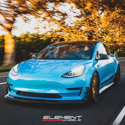 20 inch Staggered Variant TWT-3P Polished Translucent Gold w/ Gloss Black Lip on a 2017 Tesla Model 3 w/ Custom Widebody