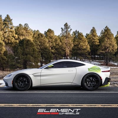 20 inch Staggered Blaque Diamond BD-F18 Gloss Black w/ Shocker Yellow Barrel on a 2019 Aston Martin Vantage
