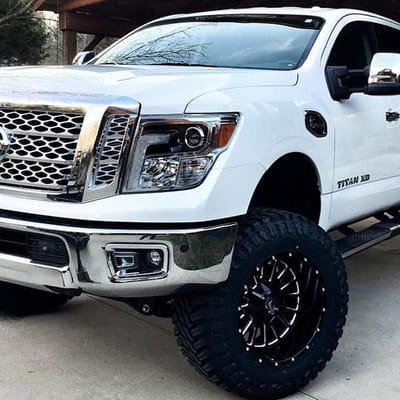 20 inch American Off-Road A105 Black Milled on 2016 Nissan Titan XD Lifted