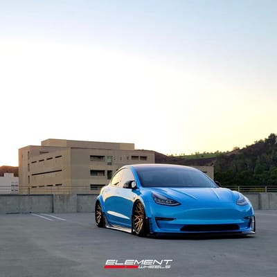 20 inch Staggered Variant TWT-3P Polished Translucent Gold w/ Gloss Black Lip on a 2017 Tesla Model 3 w/ Custom Widebody