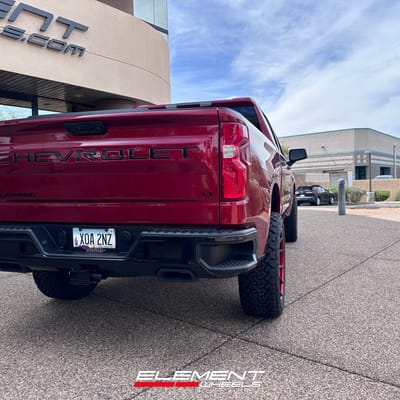 22 inch Fuel Off-Road Catalyst Matte Black w/ Candy Red Lip on a 2024 Chevrolet Silverado 1500 Trail Boss
