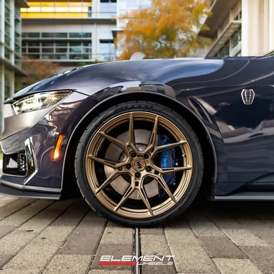 Staggered 20 inch Variant Nysa in Gloss Bronze on a 2024 Ford Mustang Dark Horse