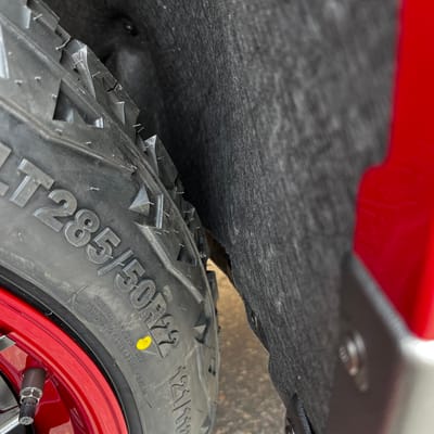 22 inch Fuel Off-Road Catalyst Matte Black w/ Candy Red Lip on a 2024 Chevrolet Silverado 1500 Trail Boss