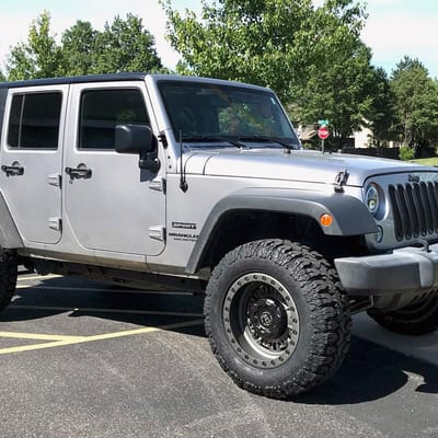 Black Rhino Abrams Gun Black w/ Machined Dark Tint Lip On A Jeep Wrangler