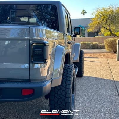 20x10 InchMoto Metal MO970 Gloss Grey w/ Gloss Black Lip on a 2023 Jeep Gladiator (Stock Height)