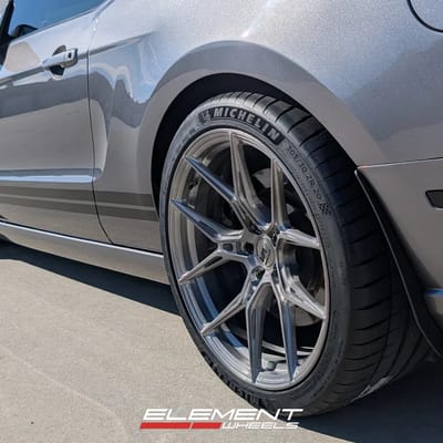 Staggered 20 inch Variant Nysa in Raw Titanium on a 2014 Ford Mustang GT500
