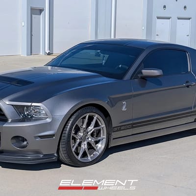 Staggered 20 inch Variant Nysa in Raw Titanium on a 2014 Ford Mustang GT500