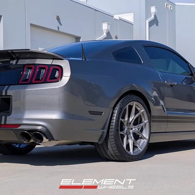 Staggered 20 inch Variant Nysa in Raw Titanium on a 2014 Ford Mustang GT500
