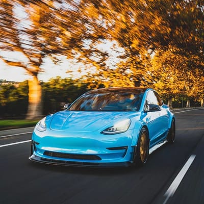 20 inch Staggered Variant TWT-3P Polished Translucent Gold w/ Gloss Black Lip on a 2017 Tesla Model 3 w/ Custom Widebody