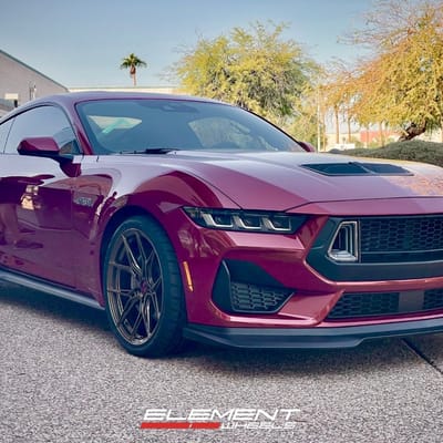 Staggered 20 inch Variant Nysa in Gloss Bronze on a 2024 Ford Mustang GT