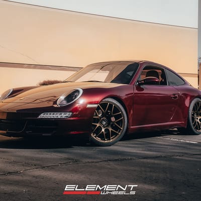Staggered 19 Inch Ruger Mesh Matte Triple Bronze (Custom) on a 2007 Porsche 911 Carrera 997 Base Narrowbody