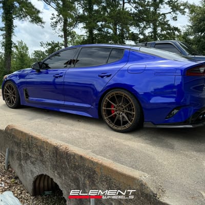Staggered 20 inch Variant Aure in Gloss Bronze on a 2019 Kia Stinger