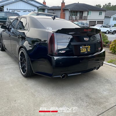 Staggered 20 inch Ferrada CM2 in Matte Black on a 2009 Cadillac CTS-V