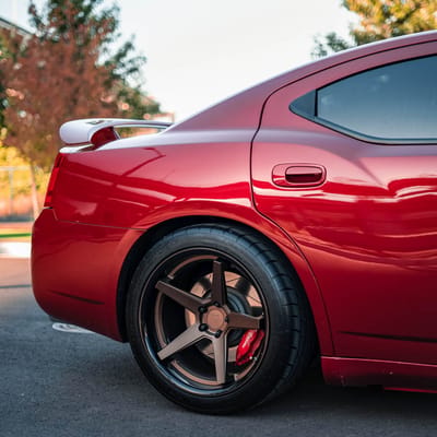 Staggered 20 Inch Ferrada FR3 in Matte Bronze w/Gloss Black Lip on a 2007 Dodge Charger SRT