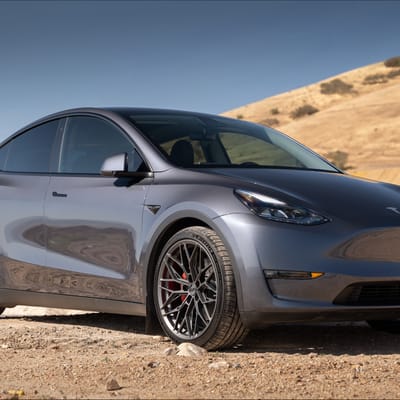 21 inch Staggered Variant Maxim's in Satin Gunmetal on a 2023 Tesla Model Y Performance