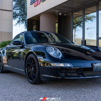 Staggered 19 Inch Variant Radon in a Gloss Piano Black on a 2006 Porsche 911 4S Carrera 997