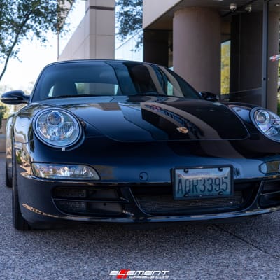 Staggered 19 Inch Variant Radon in a Gloss Piano Black on a 2006 Porsche 911 4S Carrera 997