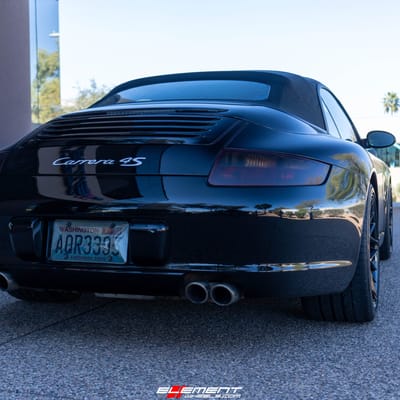 Staggered 19 Inch Variant Radon in a Gloss Piano Black on a 2006 Porsche 911 4S Carrera 997