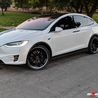 Staggered 22" Blaque Diamond BD-23 In Gloss Black W/ Stainless Steel Lip on a 2018 Tesla  Model X