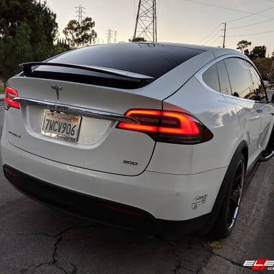 Staggered 22" Blaque Diamond BD-23 In Gloss Black W/ Stainless Steel Lip on a 2018 Tesla  Model X