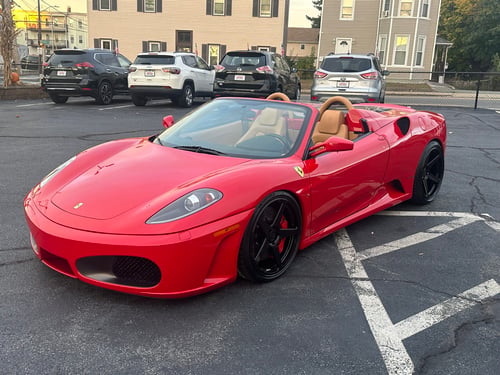 Staggered 20 inch Variant Sena's in Gloss Black on a 2009 Ferrari F430
