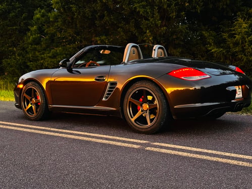 Staggered 19 inch Variant Sena in Gloss Bronze on a 2010 Porsche Boxster S