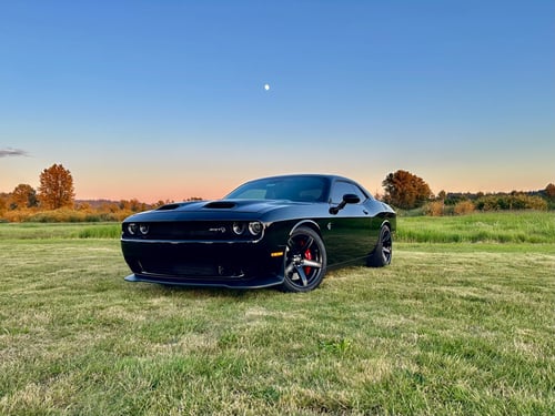 20 inch Staggered Factory Reproduction FR77's in Gloss Black on a 2020 Dodge Challenger
