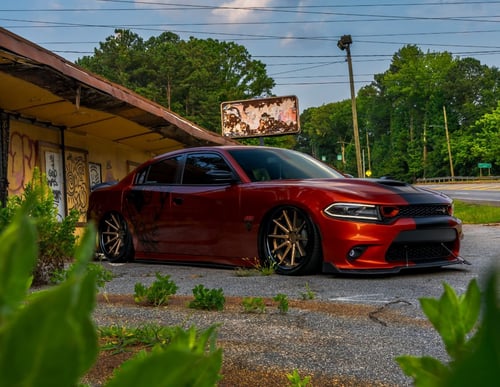 Staggered 22 inch Ferrada FR4 in Matte Bronze w/ Gloss Black Lip on a 2021 Dodge Charger