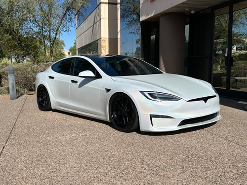 Staggered 21 inch Variant Formula Satin Black Center, Gloss Black Outer, Blue Fasteners on a 2021 Tesla Model S