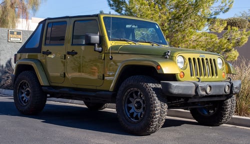 18 inch Dirty Life 9301 Roadkill Matte Gunmetal w/ Black Beadlock on a 2008 Jeep Wrangler JK Sahara