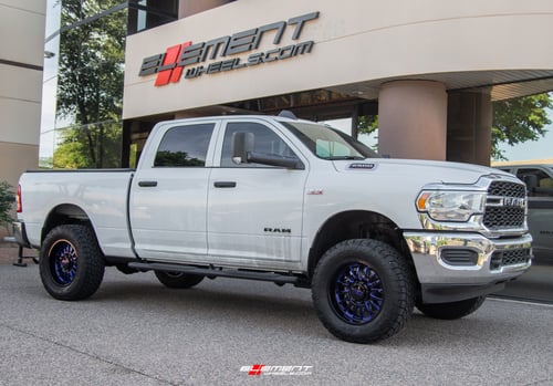 20 inch Cali Off-Road Summit 9110 Gloss Black w/ Blue Milled Spokes on a Leveled 2021 Dodge Ram 2500 HD
