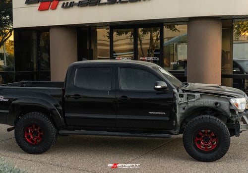 17 inch Black Rhino Riot Beadlock Candy Red w/ Black Ring & Bolts on a Leveled 2013 Toyota Tacoma