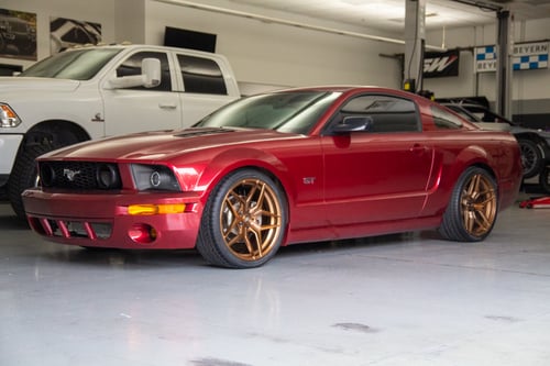 Staggered Variant Xenon in Brushed Bronze on a 2005 Ford Mustang GT