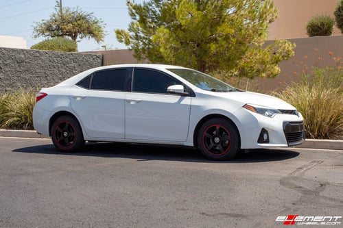 16 Inch Motegi MR116 In Black w/ Red Stripe on a 2015 Toyota Corolla