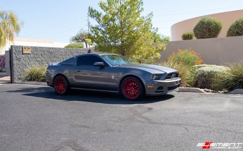 Staggered 18 Inch F1R F103 in Candy Red on a 2011 Ford Mustang Base