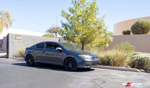 18 Inch Helo HE912 Gloss Black on a 2008 Scion TC