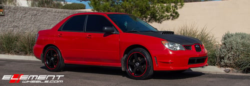 18 Inch Motegi MR116 Black W/Red Stripe on a 2006 Subaru Impreza