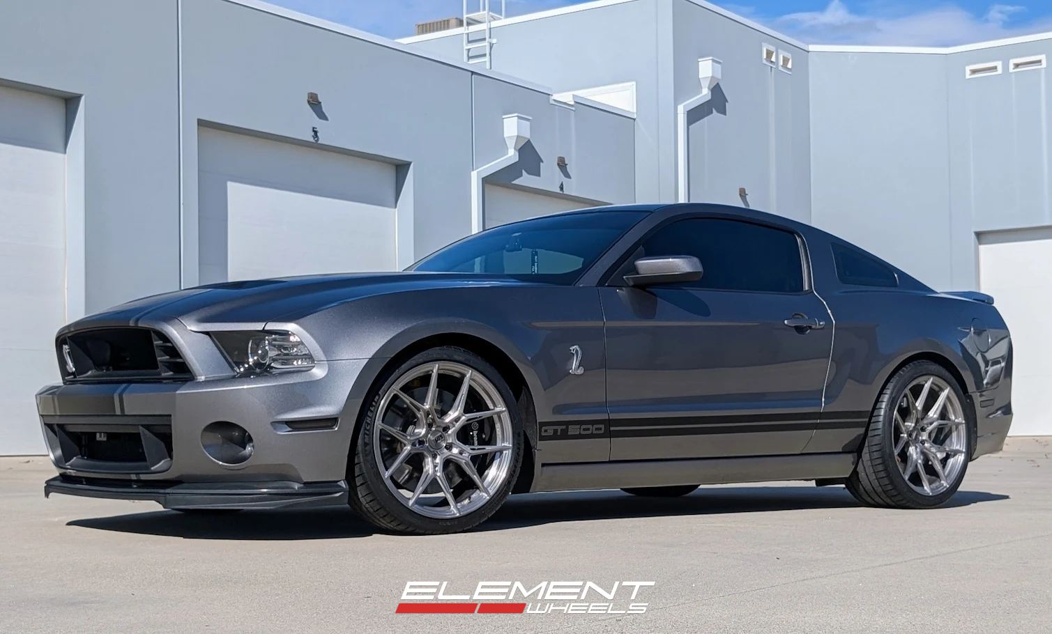 Staggered 20 inch Variant Nysa in Raw Titanium on a 2014 Ford Mustang GT500