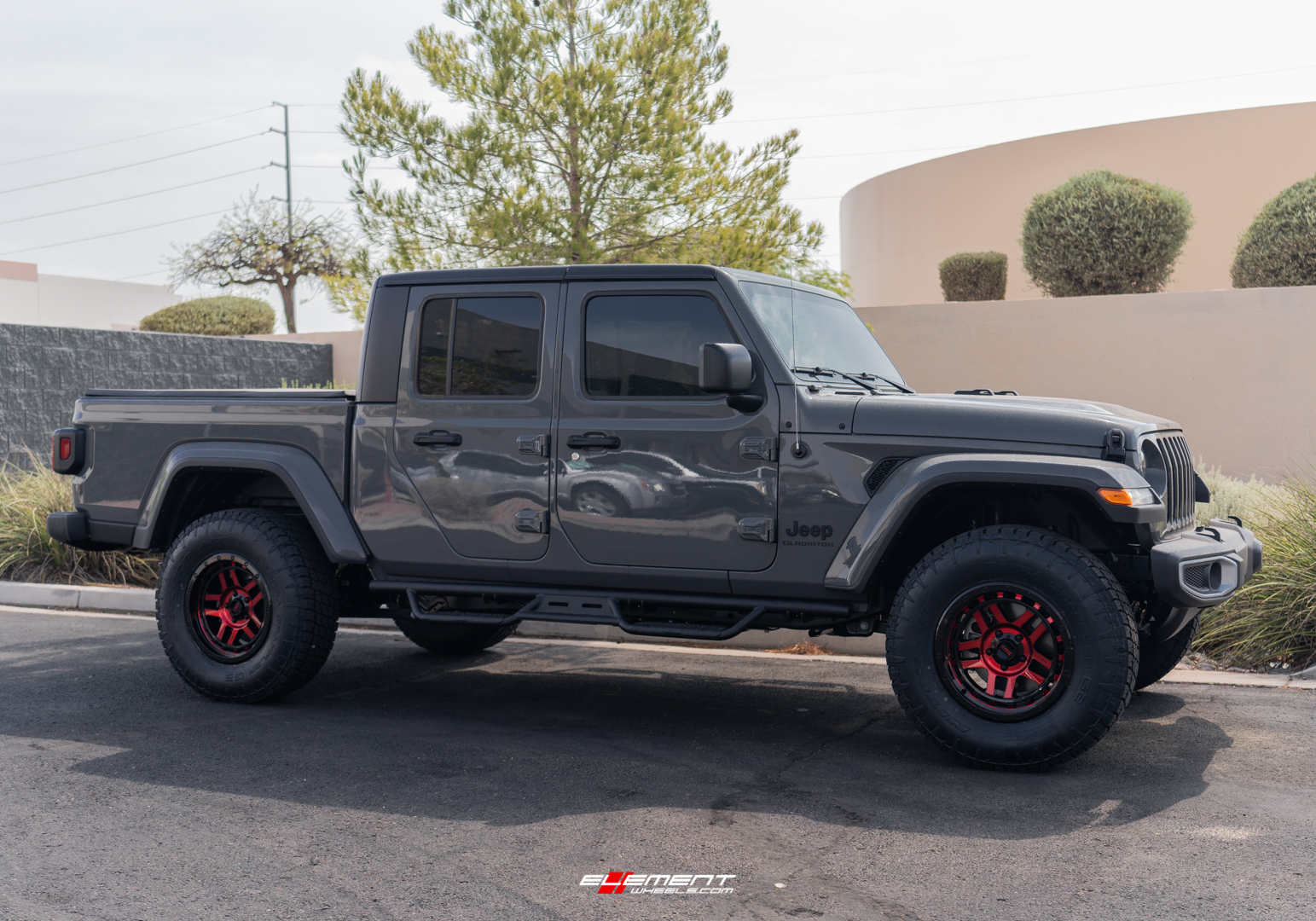 18 inch KMC KM540 Recon Gloss Black Machined w/ Red Tint on a Lifted 2021 Jeep Gladiator