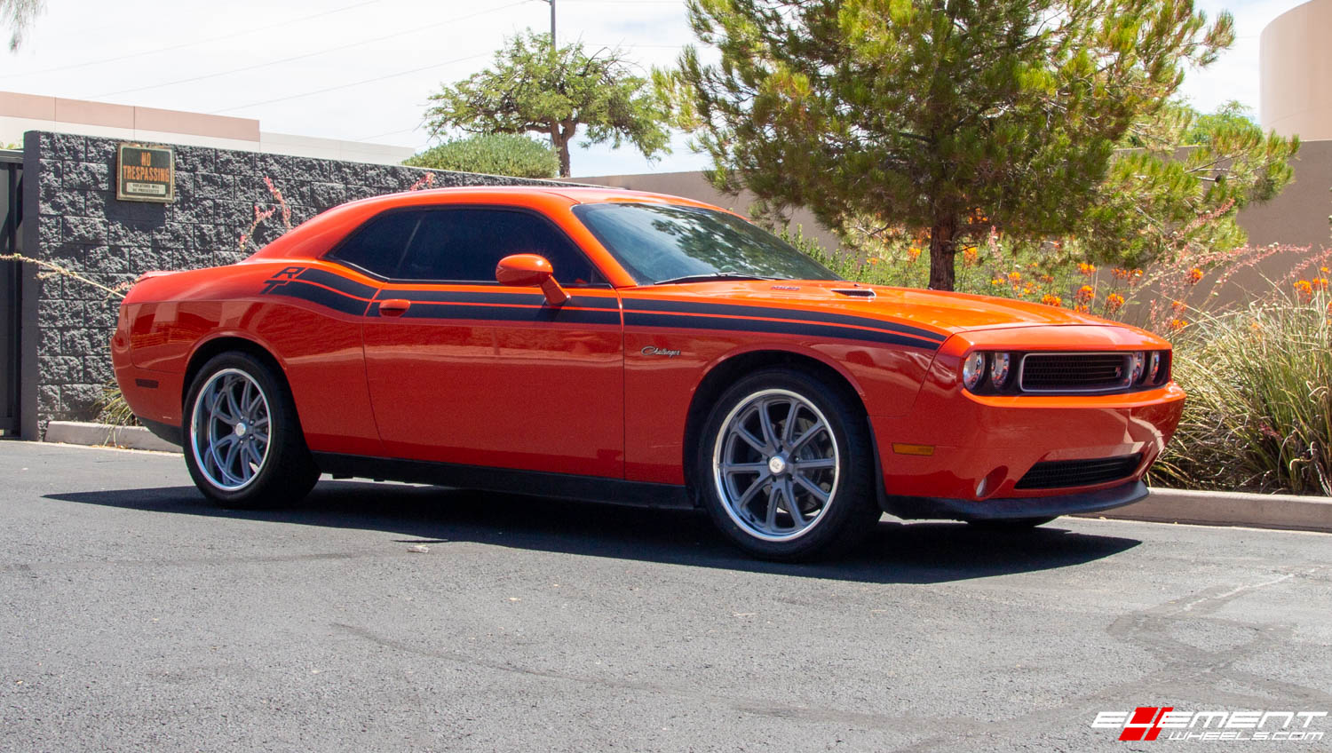 Staggered 20 Inch US Mag U111 Rambler Gray W Diamond Cut Lip on a 2013 Dodge Challenger