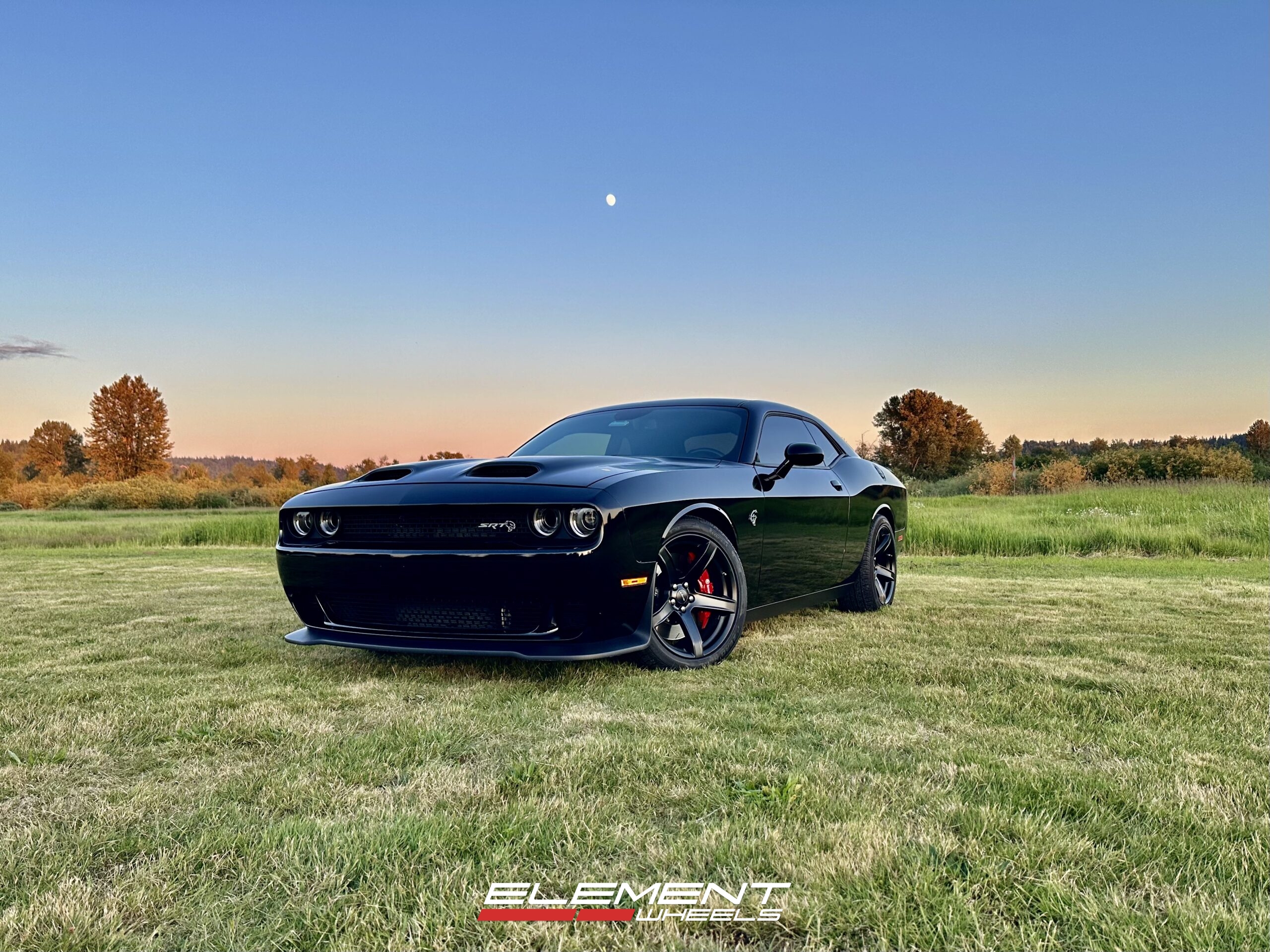 20 inch Staggered Factory Reproduction FR77 in Gloss Black on a 2020 Dodge Challenger